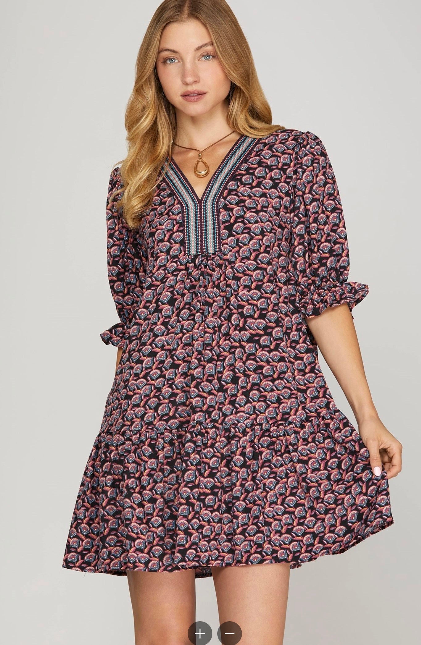 Bohemian-inspired tiered mini dress.